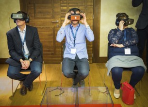 ITA Italy Castelfalfi participants try out VR glasses during a conference for tourism managers