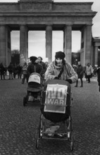 DEU, Germany, Berlin, 15.02.2003. Woman with stroller during a demonstration against the war in