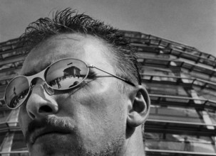 DEU, Germany, Berlin, 11.06.2000, The German Reichstag building reflects in a security guard's