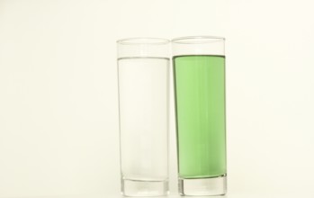 Two glasses of green liquid on white background, São Paulo, Brazil