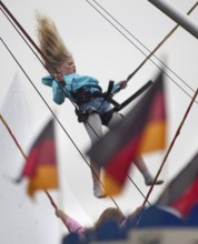 DEU Germany Berlin girls jumping on trampolines. Scene on the eve of the 20th anniversary of German