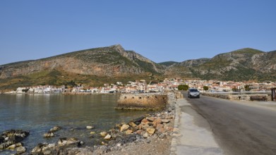 Road leads along the coast of a town against a mountainous backdrop, Monemvasia, Monemvassia,