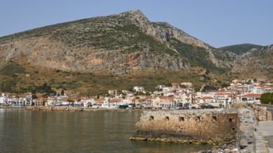 Small coastal town on a rocky coast surrounded by high mountains, Monemvasia, Monemvassia, Malvasy,