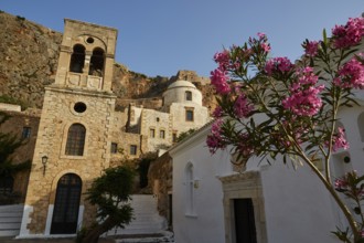 Holy Church of Christ in Chains, Elkomenos Christos, church and tower in front of a rock, with