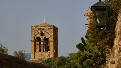 Soft morning light, Holy Church of Christ in Chains, Elkomenos Christos, bell tower with cross next