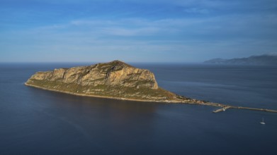 Drone shot, rocky island in calm sea under a blue sky, Monemvasia, Monemvassia, Malvasy, Byzantine