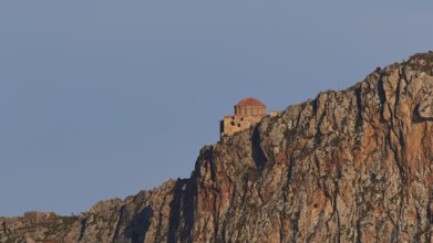 Orhodox church of Hagia Sophia, small chapel on a rocky mountain in the sun, Monemvasia,