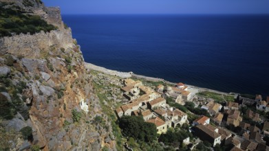 Coastal panorama with villages and cliffs falling down to the vast blue sea, Monemvasia,