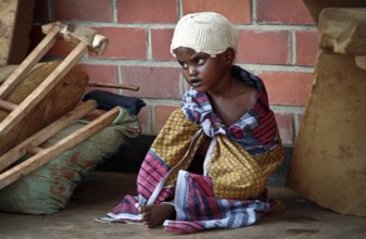 RWA Rwanda Kigali Injured Tutsi refugee children receive medical care in a makeshift hospital by