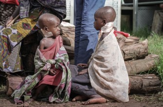 RWA Rwanda Kigali Injured Tutsi refugee children receive medical care in a makeshift hospital by