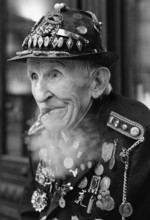 DEU, Germany, Berlin, 02.03.1998, An old man, in decorated uniform, smokes