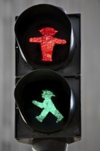 Pedestrian traffic light with red east traffic light man Stoppi and green east traffic light man