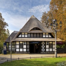 Entrance to Dahlem-Dorf subway station, thatched half-timbered house in the style of a North German