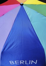 The Berlin font on an umbrella with all colors of the rainbow, symbolic photo, Berlin, Germany