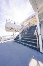 A steep staircase leads up to a deck, with a wide view of the sea, Schifffahrt, Lake Constance,