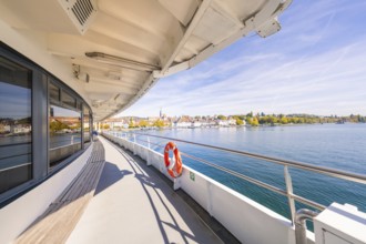 View from the ferry of a coastal town with clear sky, boat trip, Lake Constance, Germany