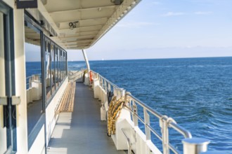 View along the ship side of the vast blue sea under a clear sky, boat trip, Lake Constance, Germany