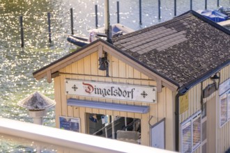 Close-up of a building at a pier in sunlight, boat trip, Lake Constance, Germany