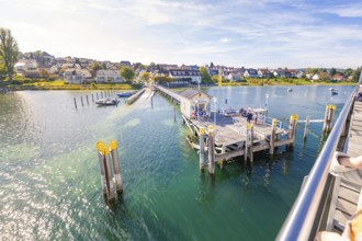 View from a ship of an open pier on the water, Schiff Fahrt, Lake Constance, Germany