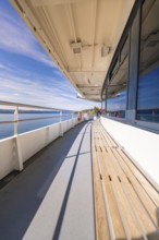 Empty ship deck with sea view under clear blue sky, boat trip, Lake Constance, Germany