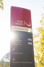 Signpost in Nagold City Park in autumn sunlight, Nagold, Black Forest, Germany