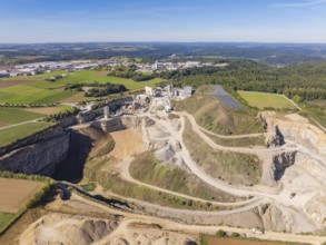 A large quarry with surrounding fields and forests from the air, Nagold, Black Forest, Germany