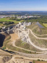 An industrial complex in a quarry in a rural area with fields, Nagold, Black Forest, Germany