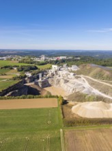 A spacious aerial view of a quarry surrounded by fields and forests, Nagold, Black Forest, Germany