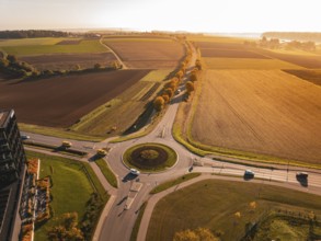 Extensive landscape with roundabout and fields, colored in autumn at sunset, Nagold, Black Forest,
