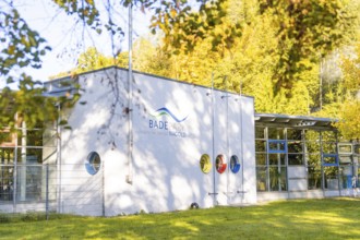 Modern building surrounded by autumn trees, illuminated by sunshine, Nagold, Black Forest, Germany