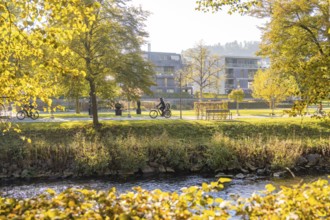 Quiet autumn day with bikes and buildings on the river, Nagold, Black Forest, Germany