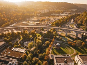 A viaduct in an autumn urban landscape, surrounded by buildings and parks, Nagold, Black Forest,