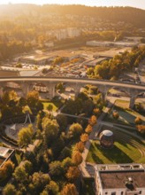 A viaduct spans a city characterized by autumn colors and various buildings, Nagold, Black Forest,