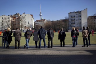 DEU Berlin spectators are watching a soccer game in Berlin-Mitte. Germany Berlin People watching a