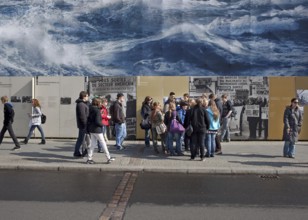 DEU Berlin A giant poster with waves advertising a Norwegian natural gas provider is hanging at