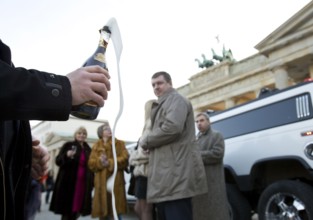 DEU Berlin Wealthy Russian tourists taking a city tour in a stretch limousine stand in front of the