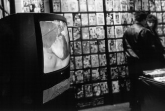 Berlin, DEU, 10.01.2000 -- Pornographic videos to watch and buy at the Berlin erotic fair: