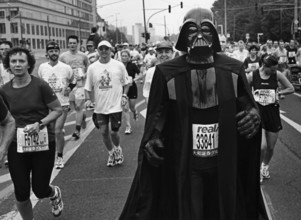 DEU, Germany, Berlin, 27.09.1999, A man wearing Dark Wader costume runs the Berlin Marathon