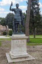 Statue of Emperor Hadrian on pedestal with inscription IMP for Emperor CAESARI HADRIANO AVG