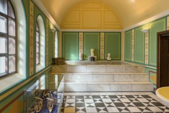 View of reconstructed Roman ancient Roman caldarium hot bath heating room with hot water pool under