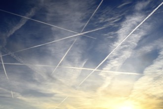 Airplanes with contrails in the sky in Hamburg, Germany