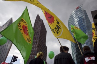 Germany Berlin Anti-nuclear power demonstration in Berlin Mitte. Demonstrators with flags in front