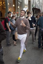 DEU Berlin tourist in bunny costume and doner kebab on Rosenthaler Straße in Berlin Mitte. He's