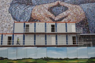 DEU Germany Germany Berlin large poster with Angela Merkel's hands, Merkel diamond, on a building