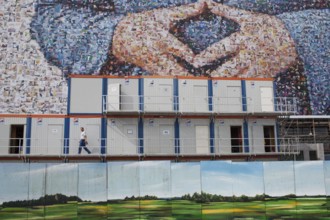 DEU Germany Germany Berlin large poster with Angela Merkel's hands, Merkel diamond, on a building