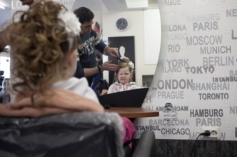 DEU Germany Neuwied A girl in the mirror at the hairdresser. Germany Neuwied A Girl in the Mirror