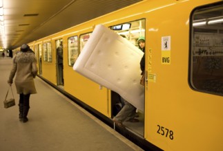 DEU Germany Berlin traveler with mattress boards the U 9 towards Osloer Straße in the