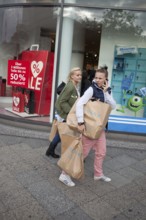 DEU Germany Germany Berlin Young girls with Primark shopping bags on Kurfürstendamm in Berlin