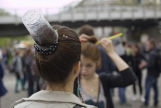 GERMANY A woman with a plastic cup as a fashionable hairstyle at the May 1 rally in Kreuzberg.