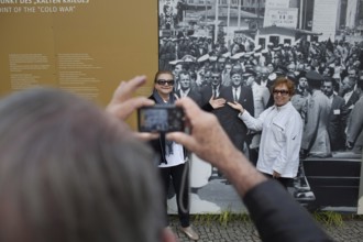 DEU Germany Germany Berlin tourist photographs friends with JF Kennedy and Willy Brandt at
